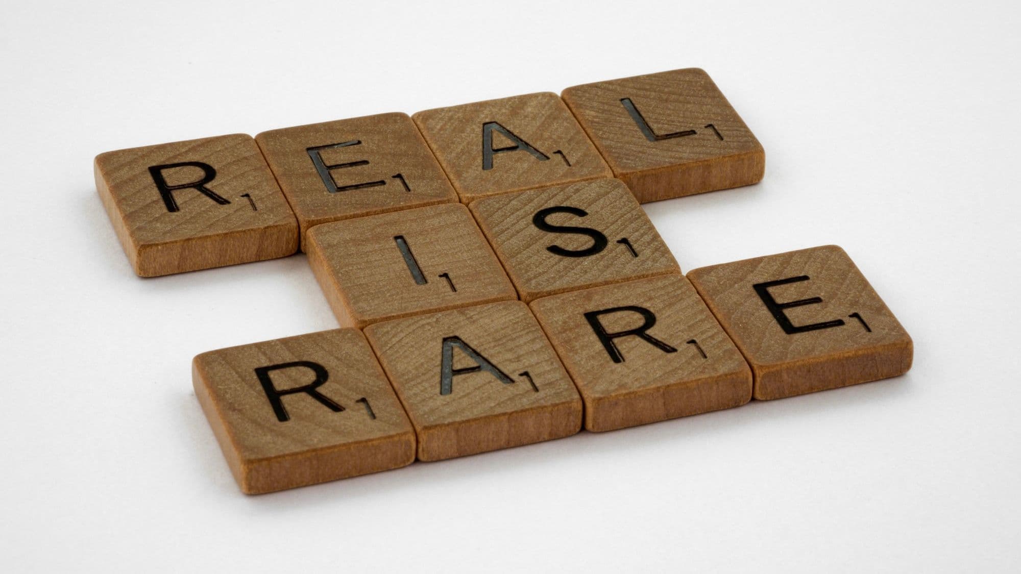 Photo of scrabble tiles saying "REAL IS RARE". Via Matt Jordan https://unsplash.com/photos/brown-wooden-blocks-with-number-6-zVkL5L7eGrw